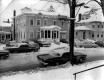 Cars Along Snow Covered Street