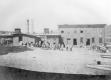 Group of men in front of a building