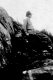 Dr. GA Campbell on rock outcrop