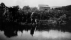 Will S. Monroe and Scottie by pond at Couching Lion Farm