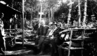 Will S. Monroe and others on bench outside Montclair Glen Lodge