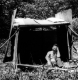 Armand Seigle in a makeshift shelter