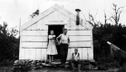 A girl, a man and a boy outside Glastenbury Camp