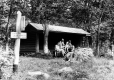 Three men in front of Madtom Notch Shelter