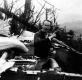 Warren Bergtrom among the B-24 bomber wreckage on Camel's Hump