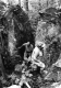 Two hikers go through "split rock" on Long Trail/Appalachian Trail 