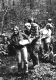 Group carrying a log on the Long trail