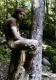 Collin Wightman sitting on a stump