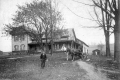 Horse and wagon in front of house