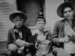 Three boys with lunch buckets