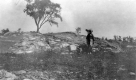 Boy next to Cambrian conglomerate, Adams Pasture