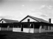 Wooden structure with two oars outside