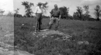 Two men at Fossiliferous exposure of Paradoxidian Cambrian St. Albans shale in  Adams Pasture