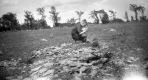 Boy on Fossiliferous exposure of Paradoxidian Cambrian St. Albans shale. In Adams Pasture