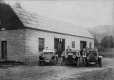 Three cars in front of a building