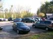 Car lot with Riverside Ave/Route 2 in the background