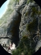 Three People Sitting in Front of the Cave of Winds