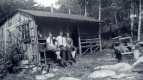 Three People Sitting in Front of Shelter at Montclair Glen