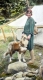 Woman with Dog at Campsite