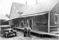 Two Workers posing in front of Old Grist Mill, West Burke