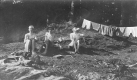 Three Young Men Waiting for Dry Clothes