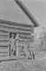 Three young men in front of Battell Lodge on the Long Trail