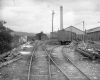 Train Parked by Industrial Mill
