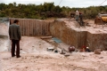 Businessmen talking to Worker in Marble Quarry