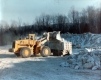 Construction Vehicles moving rocks 