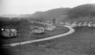 Small houses surrounding a dirt road