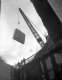 Crane holding a massive marble slab