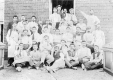 Workers outside a Brick Building