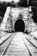Train Tracks Toward a Tunnel