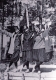 Three Woman In Front of Building