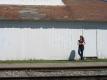 Woman Outside of Middlebury Railroad Station - Sanel Auto Parts Company