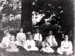 Girls seated on lawn for a photograph 