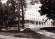 Two Men Lounging about in front of the Middlebury Inn