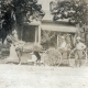 Horse and Carriage  with People in front of a House