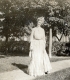 Woman Standing on Sidewalk