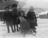 Children and Baby on a Sled in Winter
