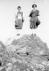 Two Women Posing at Top of Rock