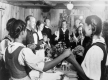 Family Holding Hands around Dinner Table