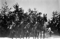Three Men on Horseback