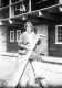 Woman holding Large Saw