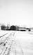 Buildings in Snow-Covered Landscape