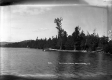Canoes and Pier on Beach at Caspian Lake