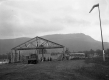 Hangar Frame Construction and wooded hill