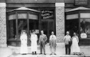 Workers in front of Shop