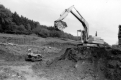Backhoe and bulldozer next to Ditch
