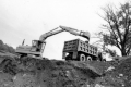 Backhoe Dumping Dirt